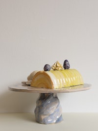 a cake is sitting on a cake stand